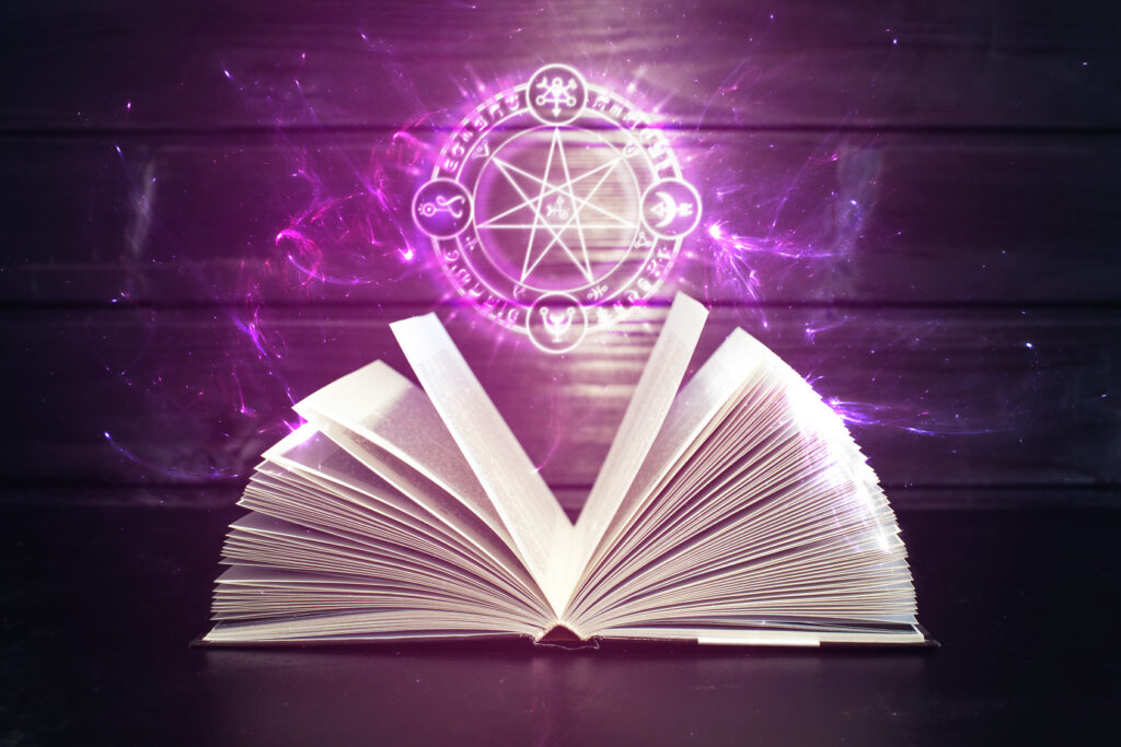 book on the table out comes light and magic sign